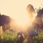 woman standing on grassfield