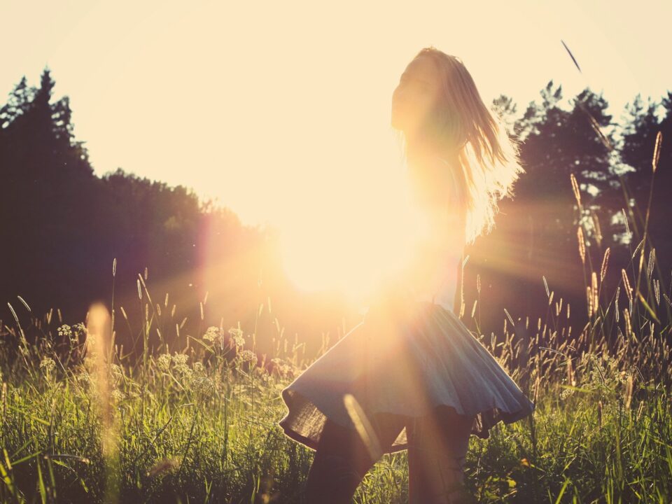 woman standing on grassfield