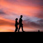 silhouette photography of man and woman