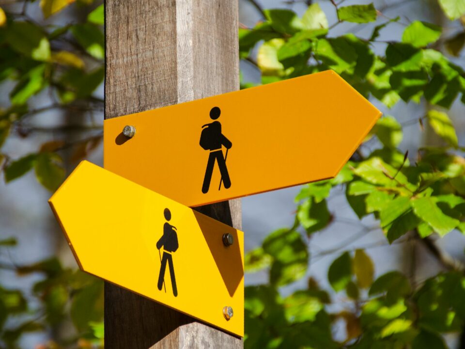 yellow road signage at daytime