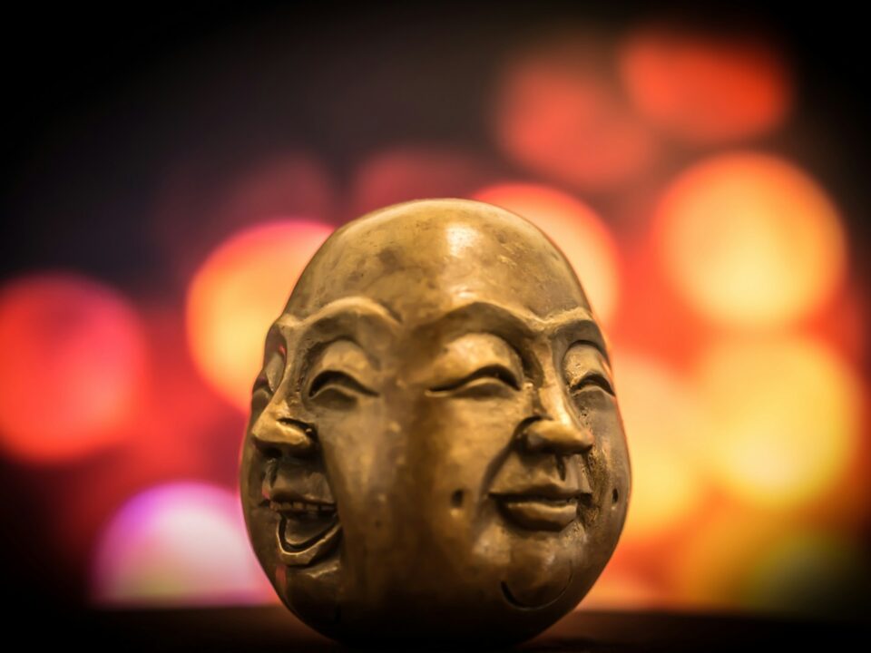 selective focus photography of buddha bust decor