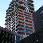 a tall building next to another tall building