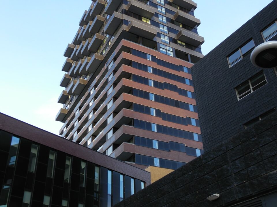 a tall building next to another tall building