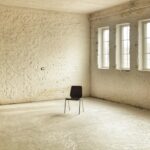 black chair beside brown wall