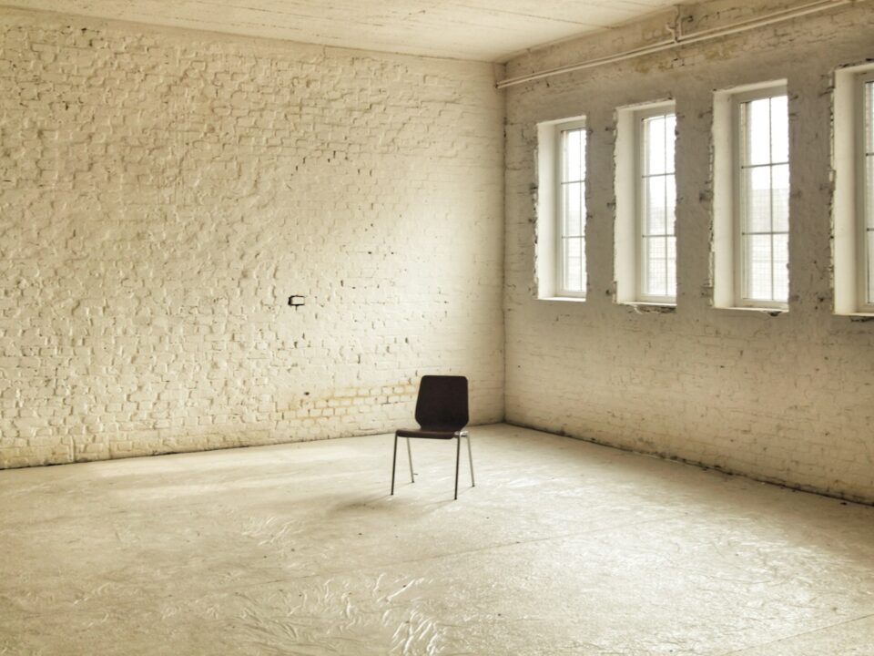 black chair beside brown wall