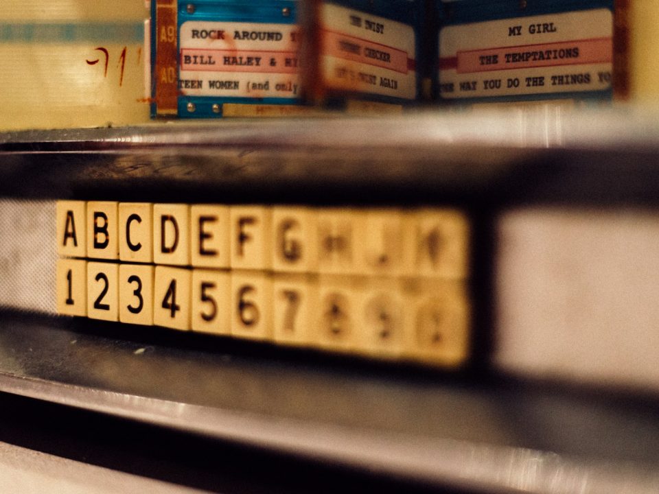 selective focus photo of alphabet and latter tile