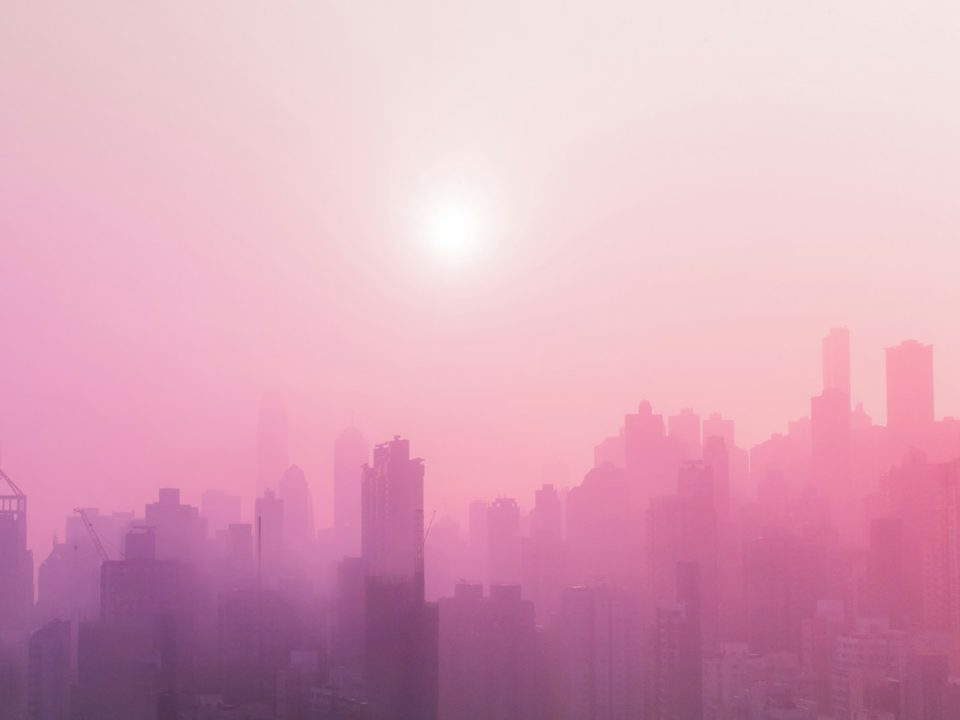 skyscraper covered with fog at daytime