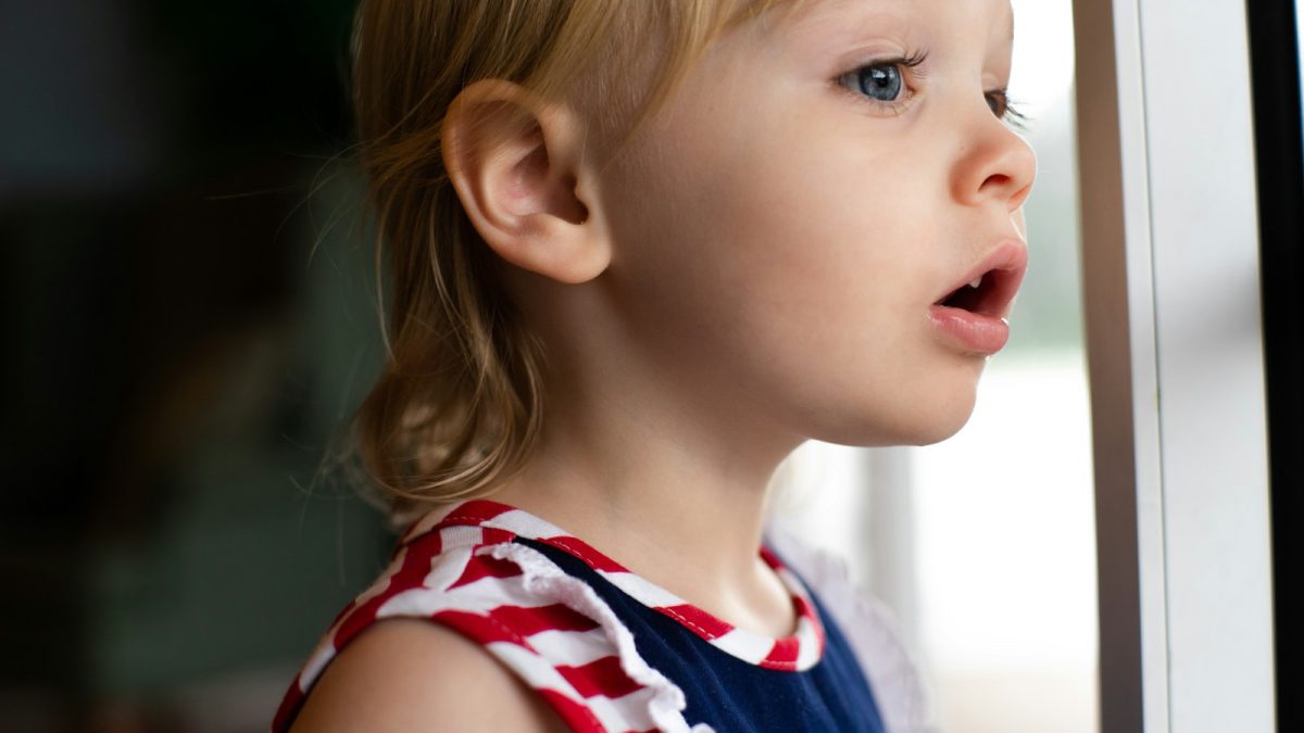 girl in blue and white tank top